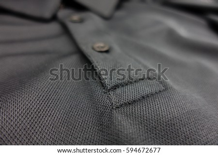Detail of black polo shirt Royalty-Free Stock Photo #594672677