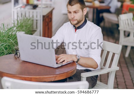 young bank employee busy on a laptop during lunch break