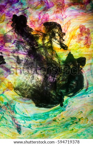 Acrylic colors and ink in water. Abstract background.