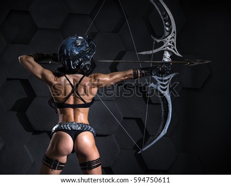 Girl in a helmet shoots from an unusual bow