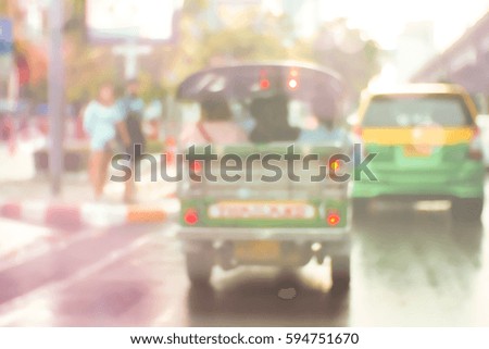Picture blurred  for background abstract and can be illustration to article of threewheeler classic motorised tuk-tuk taxi in Bangkok, Thailand