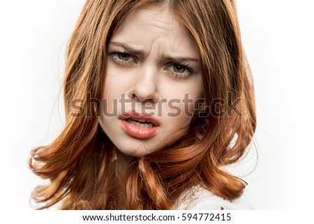 Woman on white background face closeup of sadness is not happy