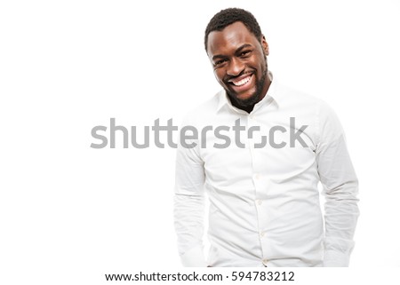 Photo of smiling young african man dressed in shirt standing isolated over white background.