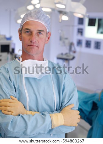 A male medical practitioner in a uniform posing in a medical clinic