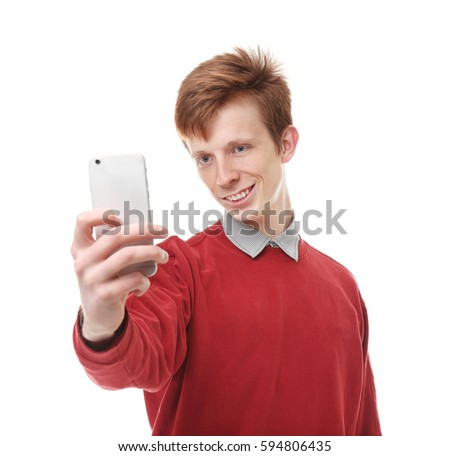 Teenager taking selfie on white background