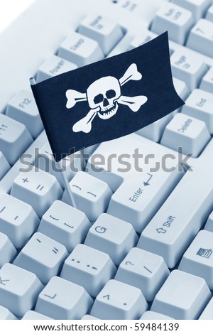 Pirate Flag and Computer Keyboard, concept of Computer Hacker