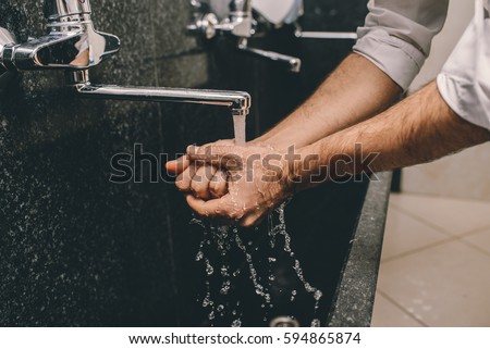 Washing hands Royalty-Free Stock Photo #594865874