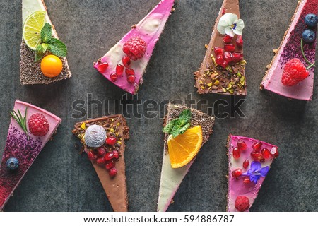 raw vegan cakes with fruit and seeds, decorated with flower, product photography for patisserie