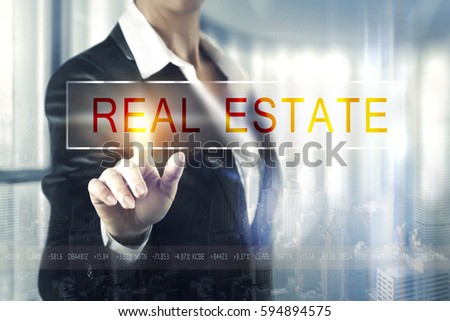 Business women touching the real estate screen