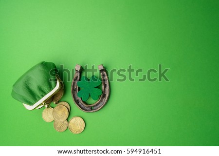 St. Patricks day, lucky charms. Horesechoe and shamrock on green background