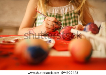 Colorful Easter Eggs star in this holiday series. Includes little girl coloring the eggs, as well as copy space images for backgrounds. Focus is on hands. 