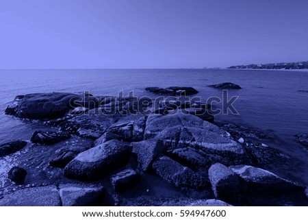 stone and water natural landscape by the sea, closeup of photo