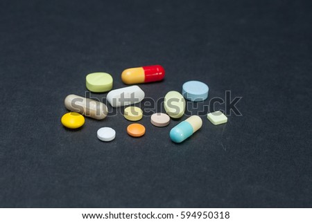 pills on black background