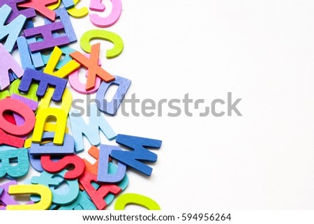 Group of English letters made by colorful wooden on white background. English language learning concept.