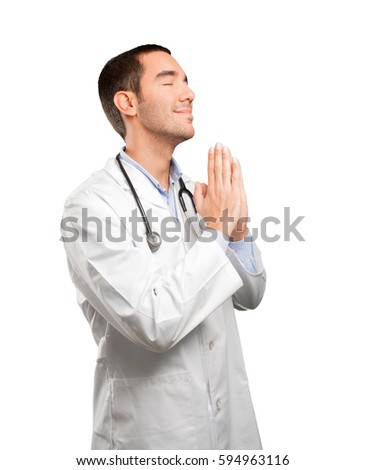 Hopeful young doctor praying