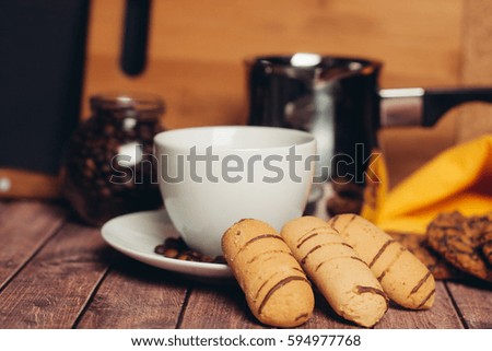 Croissants cookies in a plate mug of coffee tea