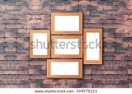 Group of blank wood picture frame on the old brick wall with copy space for moc up your product display 