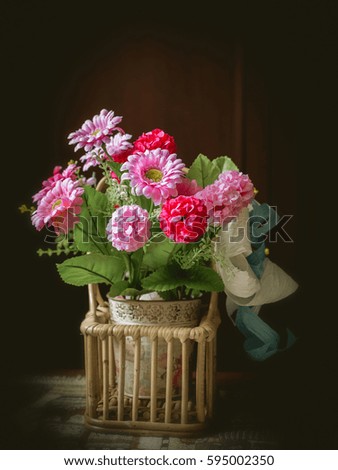 Bunch of artificial flowers in the vase (retro style)