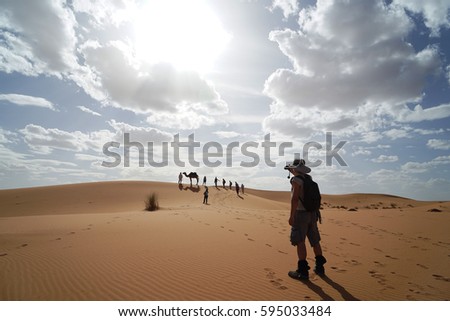 Man taking a picture in Sahara Desert, Morocco