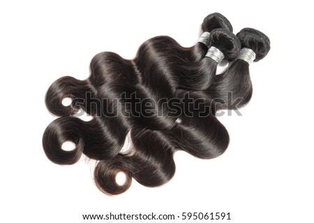 Silky body wavy black virgin remy human hair extension bundles Royalty-Free Stock Photo #595061591