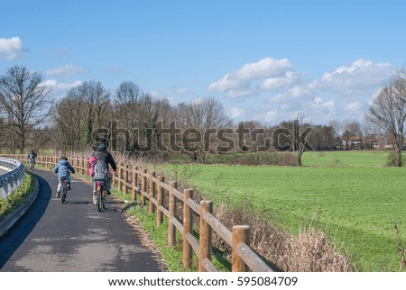 cyclists in country lane italy