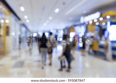 Blur of people shopping in supermarket background