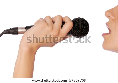 The singer sings a song in a microphone