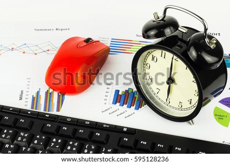 Keyboard and alarm clock calculations, savings, finances and economy concept.