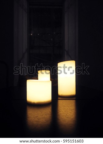 the photo of candles on the table