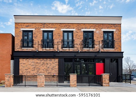 Brick Commercial Building with Black Accents Royalty-Free Stock Photo #595176101