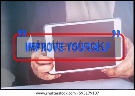 Hand and text  "IMPROVE YOURSELF" with vintage background. Technology concept.