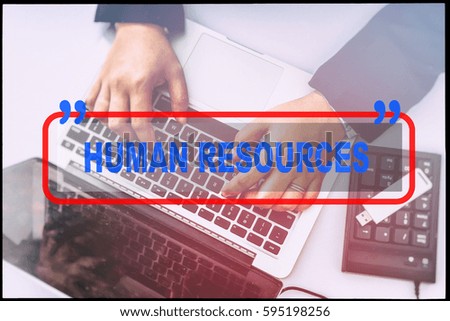Hand and text  "HUMAN RESOURCES" with vintage background. Technology concept.