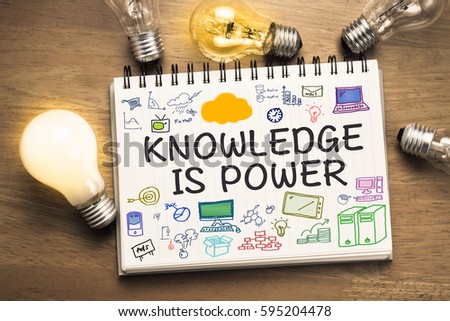 Knowledge is Power text on sketching notebook with many light bulbs