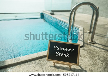 Blackboard with text summer break and swimming pool as a background.