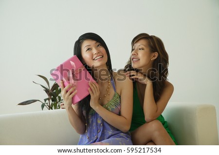 Young women with present