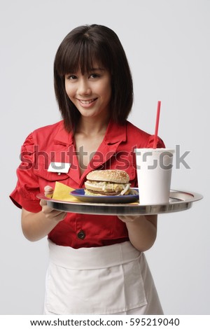Waitress serving meal