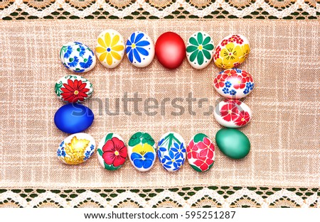 Necklace from hand-painted Easter eggs on a beautiful tablecloth