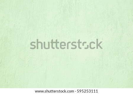 Abstract Grunge Decorative Light Green Painted Stucco Wall Texture. Handmade Rough Art Background With Copy Space For design.