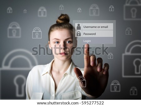 Young slim woman in white is pushing the virtual button. Log in and password concept.
