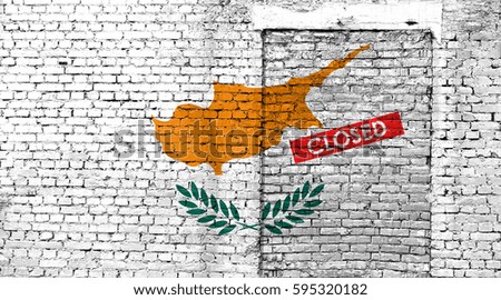 Cyprus flag on brick wall with bricked door and Closed sign