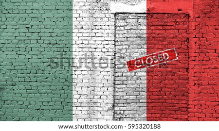 Italy flag on brick wall with bricked door and Closed sign