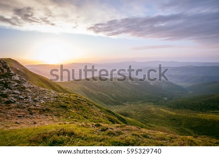 Beautiful panoramic mountain landscape at sunset. 
 Royalty-Free Stock Photo #595329740