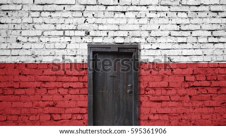 Poland flag on brick wall. Closed door in a wall