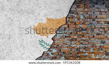 Cyprus flag painted on cracked wall. Brick wall under plaster