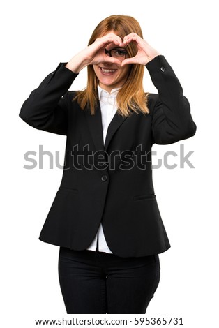 Young business woman making a heart with her hands