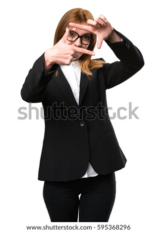 Young business woman focusing with her fingers
