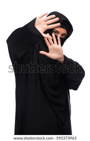 religious and people concept - muslim woman in hijab showing stop sign over white background