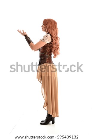 full length portrait of a beautiful girl wearing steampunk outfit, standing pose isolated on white background.