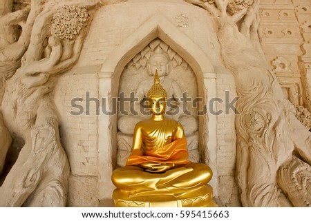 Old ancient buddha statue on background
