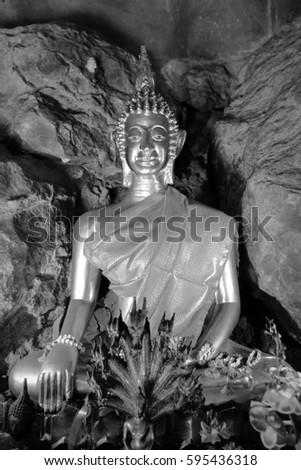 Old ancient buddha statue on background
